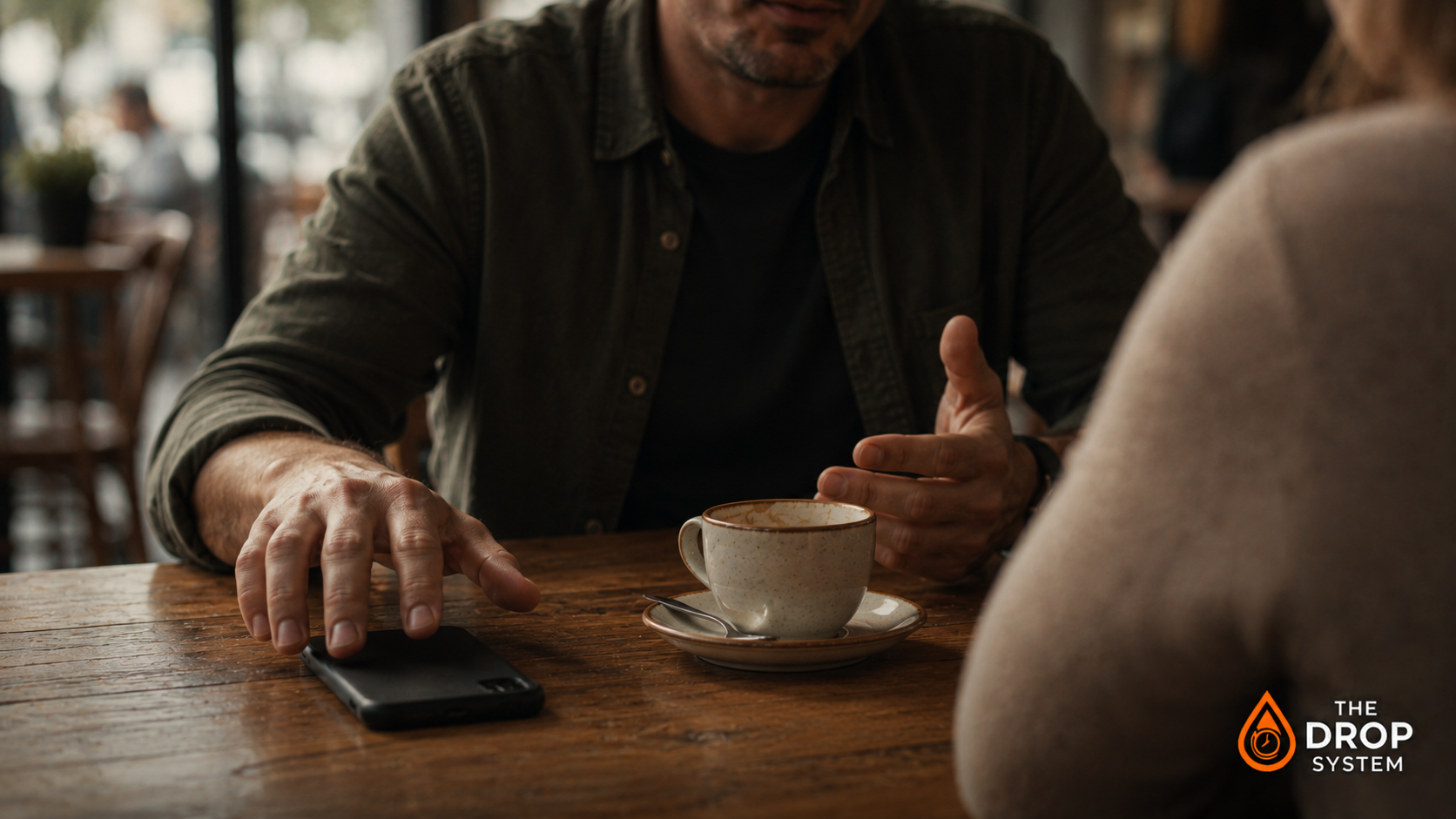 The real reason you check your phone shown through a person instinctively reaching for their smartphone during a quiet moment